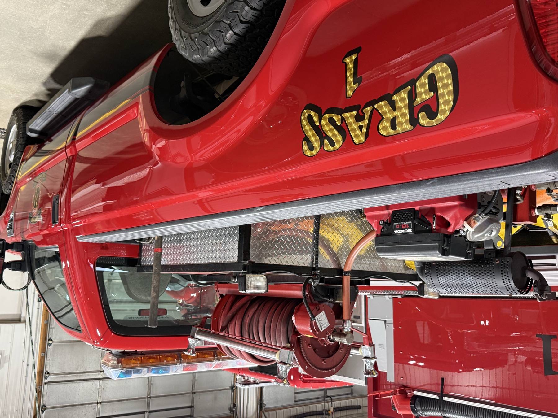 Bed skid unit: Honda-powered pump and hose reel.